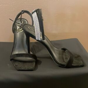 Black suede, high heel ankle strap shoes.